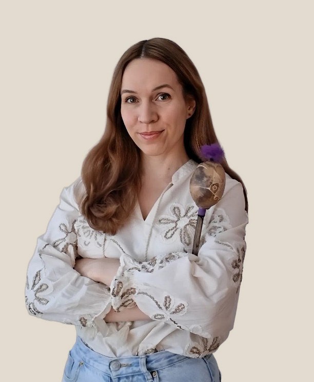 Anita Acélvári, holding a shamanic rattle